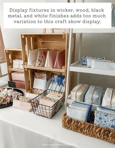 a table topped with lots of different types of bags and boxes filled with fabric material