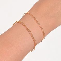 A delicate gold paperclip bracelet. Wear on its own or layer with our Figaro bracelet. This paperclip bracelet makes for the perfect layering piece. BUY 2, GET 1 FREE. Coupon applied at checkout. - Width: 2.5 mm. - Adjustable chain 6 to 8 in.- Shower safe / Tarnish resistant / Hypoallergenic- Made in gold vermeil: a thick 18k gold layer on sterling silver- 1 Year warranty Classic Everyday Paperclip Bracelet With Delicate Chain, Chic Tarnish-resistant Link Paperclip Bracelet, Gold Plated Link Paperclip Bracelet, Gold-plated Paperclip Chain Bracelet, Dainty 14k Gold-filled Paperclip Bracelet For Everyday, Dainty 14k Gold Filled Paperclip Bracelet For Everyday, Dainty Gold Paperclip Bracelet, Minimalist Gold Plated Paperclip Bracelet With Solid Links, Everyday Gold Plated Paperclip Bracelet With Oval Link