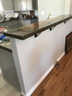 the kitchen counter is being installed and ready for painting