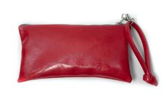 a red leather pouch is shown with the zipper open