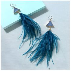 Elevate your style with these exquisite Women's Ostrich Feather Earrings. Crafted with attention to detail, these earrings feature delicate ostrich feathers that add a touch of elegance and sophistication to any outfit. The lightweight design ensures comfortable wear throughout the day, while the vibrant colors of the feathers create a stunning visual impact. Whether you're attending a special event or simply want to make a statement, these earrings are the perfect accessory to enhance your look Elegant Blue Feather Earrings, Elegant Adjustable Feather Earrings, Elegant Feather Earrings, Feather Earrings For Summer, Summer Party Earrings With Feathers, Feather Party Jewelry For Summer, Copper Style, Ostrich Feather, Earring For Women