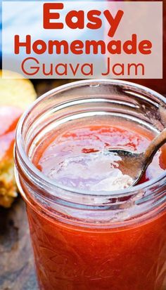 an easy homemade guava jam in a mason jar with a spoon sticking out of it