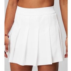 White High Waisted Fabletics Pleated Tennis Skirt - Small. Built In Shorts. New With Tags And Unworn, However Has A Small Spot On The Front Towards The Waist Band. As Pictured. It May Wash Out, I’m Not Sure What It Is. White Pleated Tennis Skirt, Female Activewear, White Pleated Skirt, Black Skort, Athletic Skort, Athletic Skirt, Pleated Tennis Skirt, Flounce Skirt, Micro Skirt