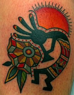 an artistic tattoo on the leg of a person with a horse and sun in the background