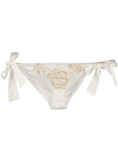 Ivory and gold silk Reverie side-tie lace and satin briefs from Gilda & Pearl featuring a floral lace pattern, an elasticated trim, a low rise and side tie fastenings. Underwear and lingerie must be tried on over your own garments. POSITIVELY CONSCIOUS: Gilda & Pearl scores 3 out 5 by independent ethical brand rating agency Good On You. It has a good animal rating and does not use fur, leather, wool, down, exotic animal skin or angora. It traces most of its supply chain manufacturers locally to reduce its carbon footprint.