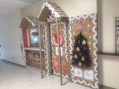 a christmas display in an office building decorated with gingerbread houses and candy canes