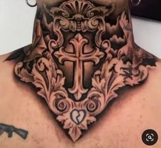 a man with a cross tattoo on his chest