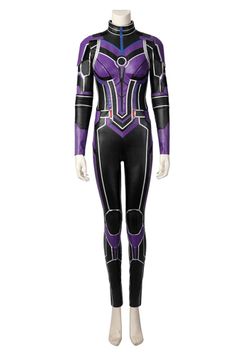 a woman wearing a purple and black suit with blue accents on the chest, standing in front of a white mannequin