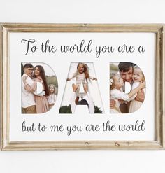 a wooden frame with the words dad and two photos on it, in front of a white wall