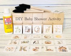 the diy baby shower activity kit is laid out next to it's contents