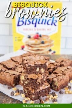 brownies stacked on top of each other in front of a bag of biscuits