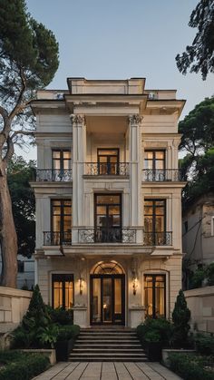 a large white house with many windows and balconies