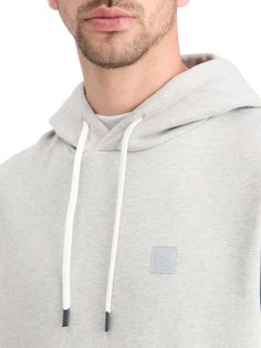 Amp up your casual look with the Essential Logo Hoodie. Crafted from 100% cotton, this hoodie offers a comfortable and edgy layering option. Whether you're heading to a weekend brunch or a laid-back day out, this hoodie provides a perfect blend of comfort and style, making it a staple for anyone looking to exude a cool and effortless vibe. 100% Cotton Wash - 30 Degrees Normal Comfy Cotton Hoodie With Adjustable Hood, Hooded French Terry Top With Double-lined Hood, Comfy Cotton Sweats With Double-lined Hood, Modern Winter Hoodie With Drawstring Hood, Modern Hooded Sweatshirt With Drawstring, Sporty Heather Grey Hoodie For Spring, Comfortable Everyday Hoodie With Drawstring, Sporty Cotton Sweatshirt For Layering, Athleisure Hoodie For Layering With Ribbed Cuffs