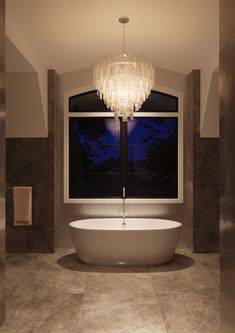 a bath tub sitting under a window in a bathroom