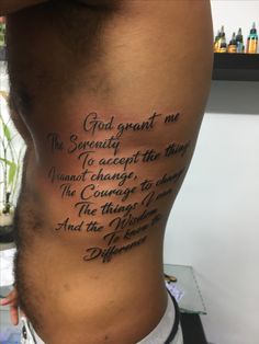 a man with a tattoo on his back saying god grant me serenity to accept the things he cannot't change