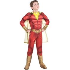 a boy in a red and yellow costume is standing with his hands on his hips