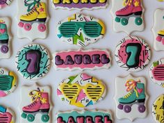 decorated cookies with roller skates and name tags on white background for birthday or baby's first birthday