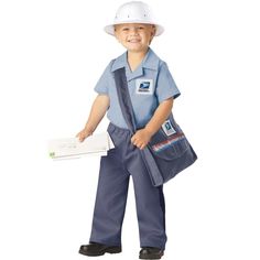 a young boy wearing overalls and a hard hat