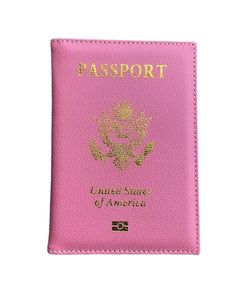 a pink passport case sitting on top of a white table