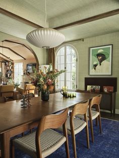 the dining room table is surrounded by chairs