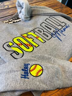 Welcome to our Etsy shop! Check out our website www.ShopRusticHills.com Here's an Etsy listing description for your embroidered "Softball Mama" sweatshirt with a customized sleeve: **Softball Mama Embroidered Sweatshirt | Custom Name & Softball on Sleeve | Perfect Gift for Moms** Show off your love for the game and your pride as a softball mom with this beautifully embroidered "Softball Mama" sweatshirt. Designed for comfort and style, this sweatshirt is perfect for cheering from the stands or s Softball Mom Sweatshirt, Embroidered Sports Sweatshirt, Sporty Embroidered Sweatshirt For Sports Season, Team Spirit Sweatshirt With Custom Embroidery For Game Day, Sporty Embroidered T-shirt For College, Team Spirit Tops With Letter Embroidery For Sports Events, Sporty Sweatshirt With Custom Embroidery For Game Day, Custom Embroidered Sweatshirt For College Sports Season, Sporty Long Sleeve Embroidered T-shirt