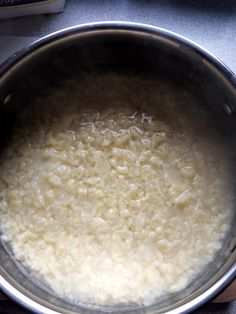 a pot filled with rice sitting on top of a stove