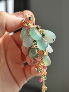 These natural aqua chalcedony are very unique, i matched them with colorful gemstones. They are full of vitality like spring. ●Aqua chalcedony ●grandidierite ●pink tourmaline ●fanta garnet ●seed beads ●total length: 81mm ● weight：6.5g Welcome to visit my Jewelry store: https://www.etsy.com/shop/Ukuly 🌸The delivery time to Most regions of North America, Australia and Europe is usually about 10-15 days. Buyers from Brazil, South Korea, and Indonesia, please provide me with your tax number through messages or notes for smooth shipment. Thank you. 🌸Please let me know your phone number when you place an order. It will be used for shipping label only. 🌸I will pack the goods very carefully and beautifully. They can be used as gifts. 🌸Thank you for liking my work. If you have any questions, pl Chrysoprase Gemstone Drop Earrings, Handmade Chalcedony Drop Earrings, Handmade Chrysoprase Dangle Jewelry, Chrysoprase Gemstone Dangle Jewelry, Chalcedony Natural Stone Drop Earrings, Chalcedony Drop Earrings With Natural Stones, Handmade Turquoise Briolette Earrings, Handmade Green Briolette Earrings, Handmade Green Briolette Gemstones