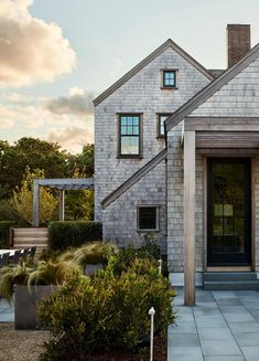 the front entrance to a house with steps leading up to it