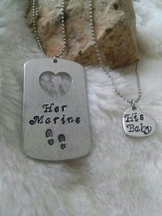 two dog tags that say her marine and his baby