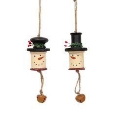 two snowman ornaments hanging from twine with bells on each one's head