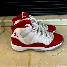 Jordan 11 2022 Cherry. Excellent Used Condition. Unisex School Age 4y. Can Be Cleaned Up To Look Brand New! Worn A Handful Of Times Before They Were Outgrown. No Box Casual White Basketball Shoes With Red Sole, Casual Jordan Shoes In University Red, Casual White High-top Sneakers With Red Sole, University Red Casual Basketball Shoes With Round Toe, Casual University Red Basketball Shoes With Round Toe, Red Sneakers With White Laces And Round Toe, Casual Red Sneakers With White Laces, Red Sneakers With White Laces For Sports, Red Sneakers With White Laces