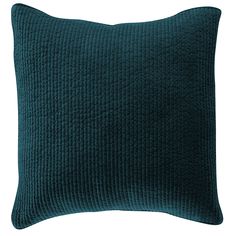 a dark blue pillow on a white background