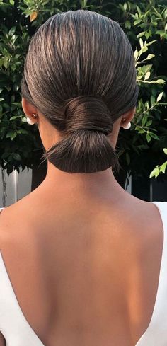 Chic Updos To Elevate Your Hair Game : Polished and sleek low bun Low Bun Bridesmaid Hair Black Women, French Twist Updo Front View, Sleek Upstyles, Simple Low Bun Wedding Hair, Updos For Dirty Hair, Updo Sleek, Chic Updo Hairstyles, Updo Simple, Straight Updo