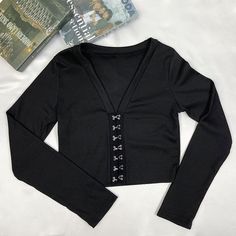 Style: Sexy Fit: Slim Fabric: Polyester Pattern: Solid Element: Non Top Length: Crop Neckline: V-Neck Sleeve Type: Regular Sleeve Length: Long Sleeve Main Composition: Polyester Season: Spring/Fall Fall V-neck Top For Club, Black V-neck Club Tops, Black V-neck Top For Night Out, Spring V-neck Crop Top For Club, Fitted V-neck Top For Club, Fitted V-neck Club Blouse, Trendy V-neck Crop Top For Club, Black Stretch Low-cut Tops, Stretch V-neck Crop Top For Club