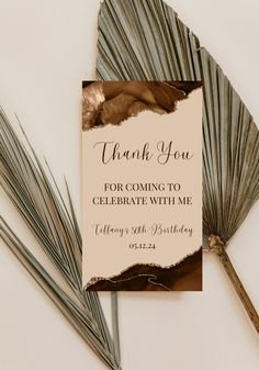 thank you for coming to celebrate with me card and palm leaves on white background, top view