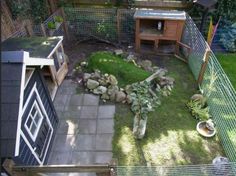 an aerial view of a backyard with a chicken coop and small garden in the back