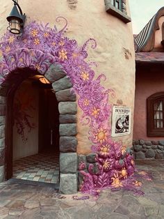 an entrance to a building with flowers painted on it