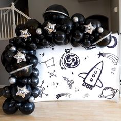 a bunch of balloons that are in the shape of an astronaut's rocket ship