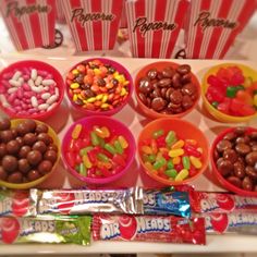 many different types of candy in small bowls