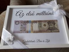 a white box with some money in it and a ribbon on the side that says g e eso'millionk