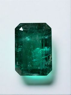 Stone: Emerald Weight: 10.99-carats Shape: Emerald Cut  Clarity: Transparent  Luster: Very Good Color: Deep Vivid Green Measurements: 15.20mm x 10.63mm x 8.08mm Geographic Origin: Zambia Treatment: Natural, Oiling Comments: Due to their growth conditions in nature and recovery methods, most emeralds contain surface-reaching features. For this reason, clarity enhancement is a common trade practice.  This gemstone comes with a certificate of authenticity. Smaragd Green, Jupiter Fl, Emerald Gem, Tiny Bow, Zambian Emerald, May Birthstone, Money And Happiness, Green Diamond, Emerald Earrings