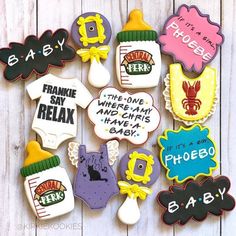 decorated cookies are arranged in the shape of baby's names and other things to eat