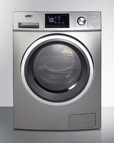 a silver washing machine sitting on top of a counter