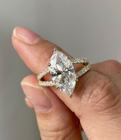 "Make a bold statement with this exquisite 3.20Ct marquise cut simulated CZ solitaire ring. The split shank adds a touch of elegance, while the 925 sterling silver band ensures durability and longevity. Perfect for any occasion, this ring is sure to turn heads and capture hearts."#solitairering #marquisediamond #simulateddiamond #splitsank #sterlingsilver #bridetobe #proposalideas #weddingring #jewelrylovers #statementpiece Marquise Diamond Ring With Halo, Split Shank Marquise Engagement Ring, Engagement Rings Split Shank, Engagement Rings Marquise Cut, Marquise Engagement Ring With Band, Unique Marquise Engagement Ring, Wedding Ring Marquise, Marquise Cut Rings, Split Shank Engagement Ring