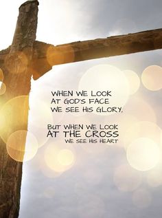 a cross with the words when we look at god's face, we see his glory