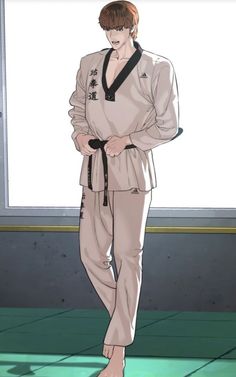 a man standing in front of a window with his hands on his hips while wearing a karate outfit