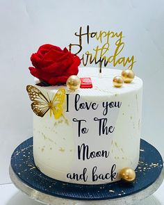 a birthday cake with the words i love you to the moon and back written on it