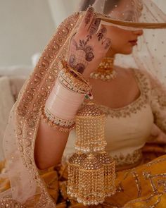 a woman with henna on her head and arm