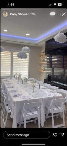 a long table set up with white chairs