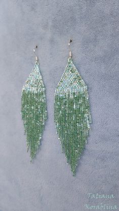 These handmade author's bright sparkling iridescent earrings are made of high-quality Japanese microscopic beads Delica. These earrings look very elegant and weightless. Color:mint . 100% hand made with love! Measurements: Length with hook - about 11.5 cm( 4,52 inch ),Width -3 cm (1,18 inch) Materials: Silver plated ear hooks Japanese microscopic beads Delica Tytan Threadbeige Green Teardrop Beaded Earrings For Party, Handmade Green Chandelier Earrings For Party, Green Chandelier Earrings For Party, Green Beaded Chandelier Earrings For Wedding, Crystal Beaded Earrings With Faceted Beads For Party, Party Crystal Beaded Earrings With Faceted Beads, Elegant Green Beaded Crystal Earrings, Handmade Green Beaded Earrings For Party, Green Beaded Earrings With Dangling Beads For Wedding